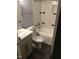 Bathroom featuring a vanity, toilet, and subway-tiled shower-tub combination at 405 Starrett Ct, Raleigh, NC 27603