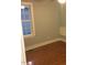 Bedroom with hardwood flooring, a window, and neutral wall color, perfect for relaxation at 405 Starrett Ct, Raleigh, NC 27603