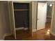 A bedroom closet with a wood shelf and hardwood floors at 405 Starrett Ct, Raleigh, NC 27603