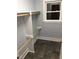 Walk-in closet featuring shelving and a window that provides natural light at 405 Starrett Ct, Raleigh, NC 27603