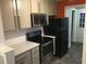 Well-equipped kitchen with stainless steel appliances, ample cabinet space, and stylish countertops at 405 Starrett Ct, Raleigh, NC 27603