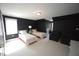 Well-lit bedroom featuring two beds, armchairs, and a large window at 423 Oakland Dr, Raleigh, NC 27609
