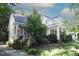 Attractive home with a covered front porch, American flag and lush landscaping around the front of the home at 423 Oakland Dr, Raleigh, NC 27609