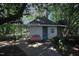 Exterior view of a shed in a lushly landscaped backyard at 423 Oakland Dr, Raleigh, NC 27609