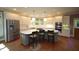 Spacious kitchen with stainless steel appliances, island with bar seating, and bright lighting, ideal for cooking at 423 Oakland Dr, Raleigh, NC 27609