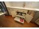 Kitchen area featuring custom white cabinets and drawers, offering ample storage and modern convenience at 423 Oakland Dr, Raleigh, NC 27609