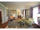 Inviting living room with hardwood floors, a patterned rug, and ample natural light at 423 Oakland Dr, Raleigh, NC 27609