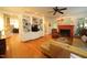 Open-concept living room boasts hardwood floors, custom built-ins, and a fireplace at 423 Oakland Dr, Raleigh, NC 27609
