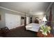 Spacious main bedroom with hardwood floors, a ceiling fan, and an ensuite bathroom at 423 Oakland Dr, Raleigh, NC 27609