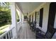 Inviting front porch with rocking chairs and ample space for relaxation, perfect for enjoying quiet mornings at 423 Oakland Dr, Raleigh, NC 27609