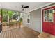 Charming covered back porch with a ceiling fan, perfect for outdoor relaxation and enjoying backyard views at 4420 Tetbury Pl, Raleigh, NC 27613