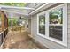 Covered back porch with overhead fan, overlooking landscaped yard and mature trees at 4420 Tetbury Pl, Raleigh, NC 27613