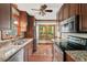 Updated kitchen features stainless steel appliances and granite countertops at 4420 Tetbury Pl, Raleigh, NC 27613