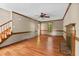 Open living room area features fireplace, wood floors, and natural lighting at 4420 Tetbury Pl, Raleigh, NC 27613