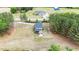 An aerial view of a spacious property with a well-maintained lawn, mature trees, and a charming two-story home at 4455 Old Us 421, Lillington, NC 27546