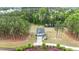 Aerial of a stunning property featuring a charming home with a long driveway, pond, and lush landscaping at 4455 Old Us 421, Lillington, NC 27546