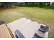 Backyard patio area perfect for entertaining with seating and a grill at 4455 Old Us 421, Lillington, NC 27546