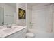 Clean bathroom with shower and tub combination, vanity, and decorative art at 4455 Old Us 421, Lillington, NC 27546