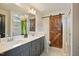 Bathroom with dual vanities and a barn door at 4455 Old Us 421, Lillington, NC 27546