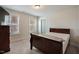 Cozy bedroom featuring natural light and a dark wood bed frame at 4455 Old Us 421, Lillington, NC 27546