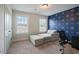 Bright bedroom with a sofa that converts to a bed and stylish star-themed wall at 4455 Old Us 421, Lillington, NC 27546