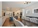 Light-filled dining room with hardwood floors and seating for eight, adjacent to the modern kitchen at 4455 Old Us 421, Lillington, NC 27546