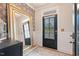 Stylish entryway with wainscoting, statement wallpaper, a large mirror and modern light fixtures at 4455 Old Us 421, Lillington, NC 27546