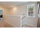 Upstairs hallway with natural light from window at 4455 Old Us 421, Lillington, NC 27546