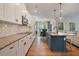 Open concept kitchen with dining area and living space, with white cabinetry and a large island at 4455 Old Us 421, Lillington, NC 27546