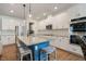 Bright kitchen with island seating, stainless appliances, and ample cabinet space and granite counter tops at 4455 Old Us 421, Lillington, NC 27546