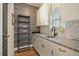 Bright kitchen featuring shaker cabinets, granite countertops, and open shelving for storage and stylish design at 4455 Old Us 421, Lillington, NC 27546