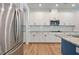 Modern kitchen featuring stainless steel appliances, white cabinets, and granite countertops at 4455 Old Us 421, Lillington, NC 27546