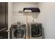 Modern laundry room with LG washer and dryer units and storage shelf at 4455 Old Us 421, Lillington, NC 27546