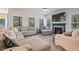 Spacious living room with a fireplace, large sectional sofa, and plenty of natural light at 4455 Old Us 421, Lillington, NC 27546