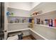 Walk-in pantry with white shelving offering abundant storage for groceries and kitchen essentials at 4455 Old Us 421, Lillington, NC 27546