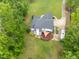 Aerial view of home with a back deck, large yard, and parking for an RV at 4612 River Farm Rd, Rocky Mount, NC 27803