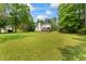 Expansive backyard and deck with mature trees at 4612 River Farm Rd, Rocky Mount, NC 27803