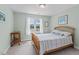 Bedroom with a window view, neutral walls, and comfortable decor at 4612 River Farm Rd, Rocky Mount, NC 27803