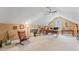 Large bonus room with sloped ceilings, natural light, and versatile space at 4612 River Farm Rd, Rocky Mount, NC 27803