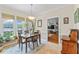 Inviting breakfast nook with views of the lake and a classic light fixture overhead at 4612 River Farm Rd, Rocky Mount, NC 27803