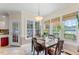 Sunny breakfast nook features large windows with views of the lake at 4612 River Farm Rd, Rocky Mount, NC 27803