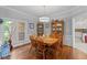 Dining room features a wood table set under a modern light fixture and hardwood flooring at 4612 River Farm Rd, Rocky Mount, NC 27803
