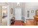 Warm and inviting foyer with hardwood floors, neutral paint, and a view of the formal dining area at 4612 River Farm Rd, Rocky Mount, NC 27803