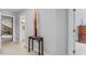 A hallway featuring a decorative table and views into a bathroom and bedroom at 4612 River Farm Rd, Rocky Mount, NC 27803