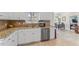 Bright kitchen featuring granite counters, stainless appliances, and white cabinets at 4612 River Farm Rd, Rocky Mount, NC 27803