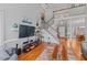 Open concept living room with hardwood floors flows into the dining room at 4612 River Farm Rd, Rocky Mount, NC 27803