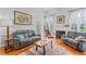 Bright living room with fireplace, comfortable seating, and a view to the front yard at 4612 River Farm Rd, Rocky Mount, NC 27803