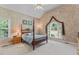 Bright main bedroom with vaulted ceilings, large windows, and a cozy ambiance at 4612 River Farm Rd, Rocky Mount, NC 27803