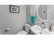 Powder room with vessel sink, decorative mirror and framed artwork at 4612 River Farm Rd, Rocky Mount, NC 27803