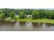 Aerial view of waterfront home with lake access from pier at 4612 River Farm Rd, Rocky Mount, NC 27803
